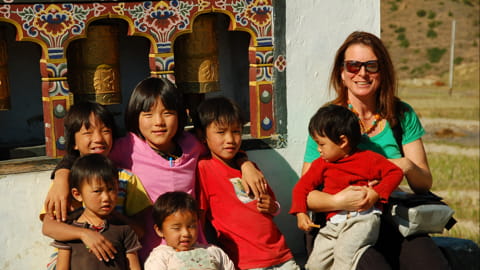 Patricia in Bhutan with children